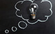 Photo of Black Chalkboard with Thought bubble and Lightbulb